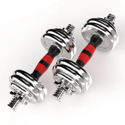 Pair of chrome dumbbells with red and black resistance bands on a white background