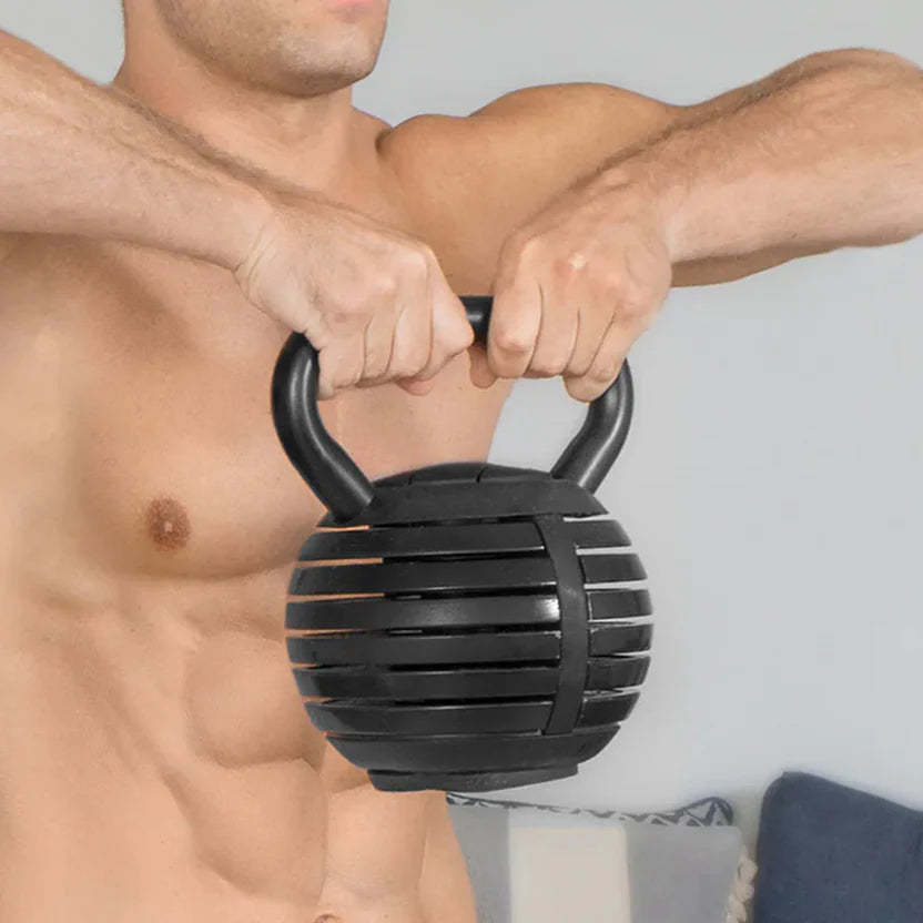 Man holding a black textured kettlebell against a neutral background