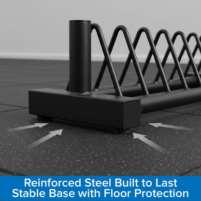Black metal security barrier with floor protection on a tiled floor.