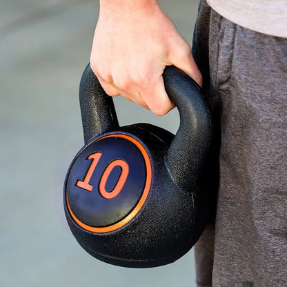 Person holding a black kettlebell with '10' marking on a blurred background