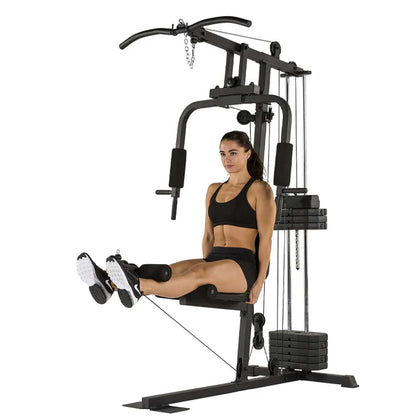 Woman exercising on a home gym machine with a white background
