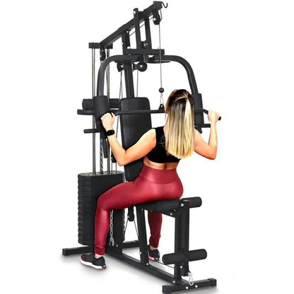 Woman exercising on a black fitness machine with a white background