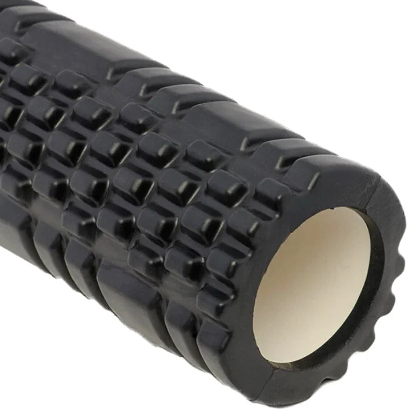 Black textured foam roller on a white background