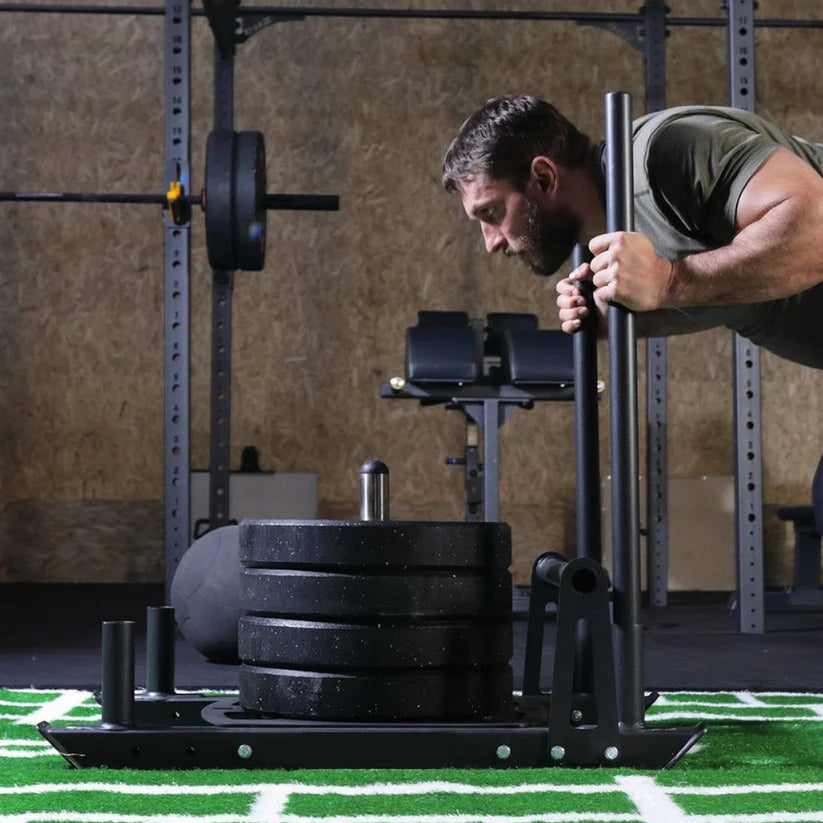 Weight plate on a stand on a football field
