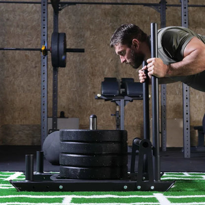 Weight plate on a stand on a football field