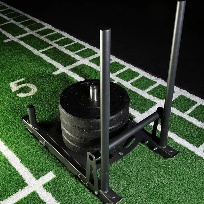 Weight plate on a stand on a football field