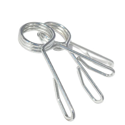 Metal spring clips on a white background