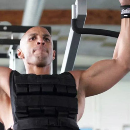 Man performing pull-ups with a weight vest in a gym setting